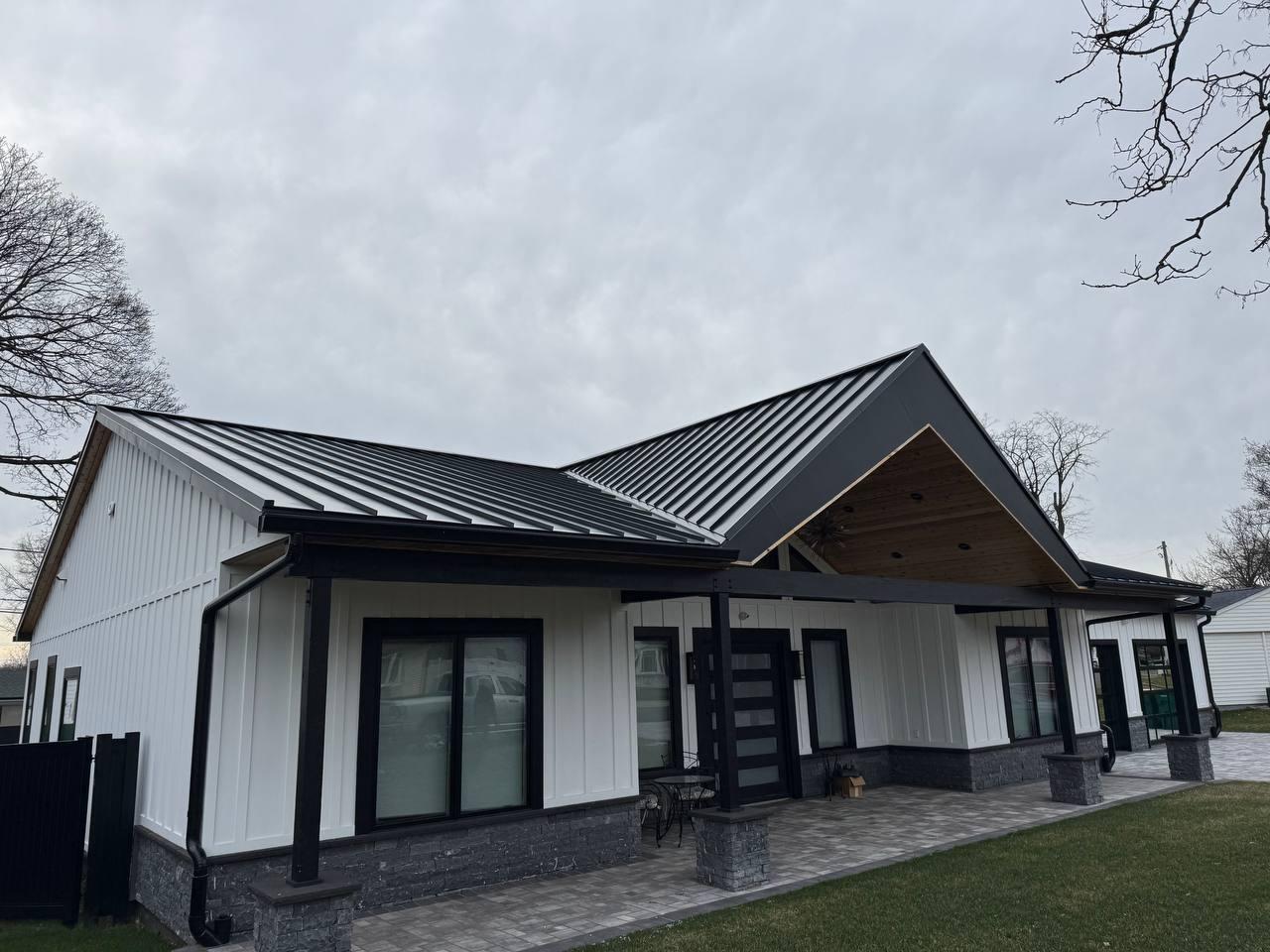 Modern home with standing seam metal roof installed by PH Services